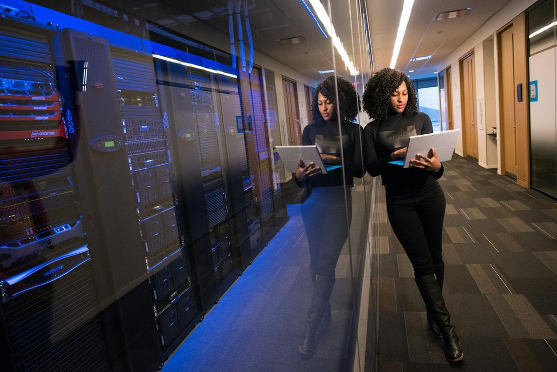 Engineers walking through a data centre